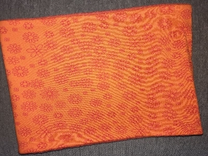 orangener Schlauchschal mit Blumen, Innenseite ist Fleece, Durchmesser 52 cm - Handarbeit kaufen