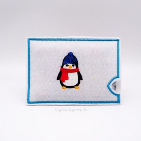Adventskalender to go in weiß, bestickt mit einem Pinguin, befüllt mit Schokolinsen, auch als Geschenkhülle für Geld, Gutschein oder Brief   