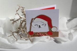 Weihnachtskarte mit Katze die eine Nikolaus Mütze trägt