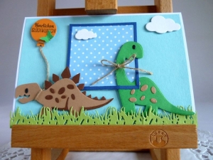 Glückwunschkarte mit Dinosaurier in hellblau/blau für einen Jungen