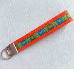 Schlüsselband, Schlüsselanhänger aus Gurtband orange mit Webband grün Sterne - Handarbeit kaufen